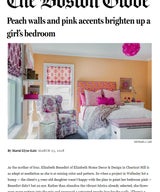 Peach walls and pink accents brighten up a girl’s bedroom