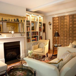 Fifth Avenue Warm and Cozy sitting room with fire place and wood wall panelling