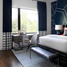 For the eldest son, we created a sophisticated and handsome space using his favorite color and love of modern design.