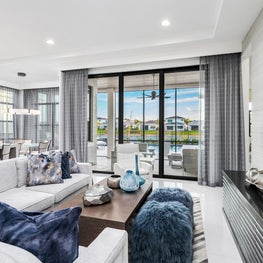 SLEEK CONTEMPORARY METALLIC RESIDENCE faux fur seats, faux fur furniture, white sofa sectional, darf wood credenza, glass doors, open concept