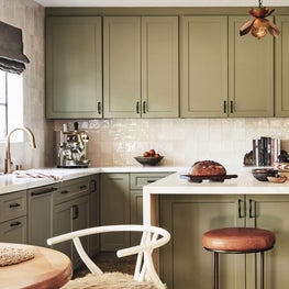 Open Kitchen with Sage Green Cabinetry, Black Hardware and Brass Faucet