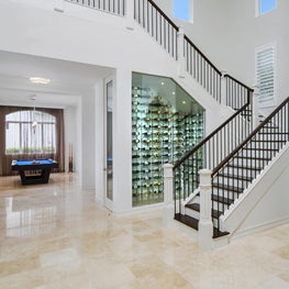 Expansive Decadent Waterfront wine cellar, entry way, foyer, pool room, marble floors, open concept, wine display