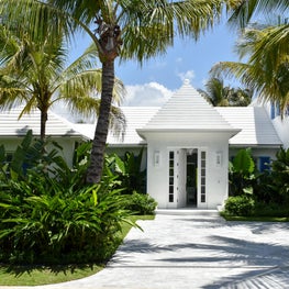 Classic buttery entry pavilion for a Palm Beach surf cottage