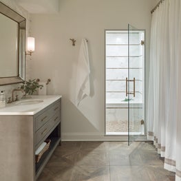 Guest Bath with Striped Shower Walls in Wood & Marble