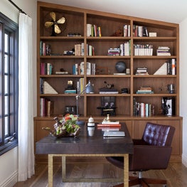 Home office in with walnut bookcase