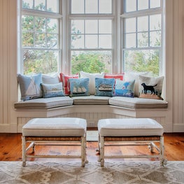 Beadboard walls are anchored by warm hardwood flooring.