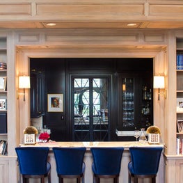 Portfolio: 1980's Home Renovation, Bar with velvet blue accent chairs inside Great Room