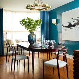 Greenwich Village Dining room with glossy green walls and dark wood furnishings