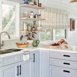 Open Plan Kitchen with Open Shelving and Vaulted Ceiling