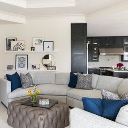 Portfolio: Cozy transitional living space with a modern twist off of the kitchen