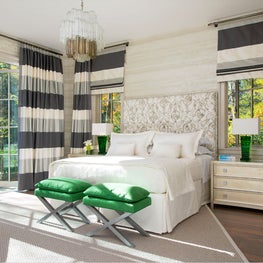 Luxe bedroom with large panel curtains