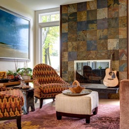Rustic slate fireplace wall : patterned earth tone fabrics