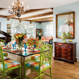 An antique chandelier hangs above a vibrant dining area.