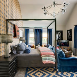 Bedroom highlighted with cobalt blue plaids and tribal textures