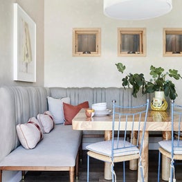 Breakfast Room with Burl Wood, Wallpaper and Vintage Chairs with Tassels Ties