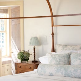 Upstate NY farmhouse, master bedroom with wooden canopy bed.