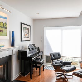 Living Room with Piano and Eames Chair
