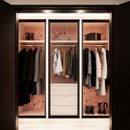 A flamboyance of flamingos and pink lacquer inside a cloak room on Park Avenue.