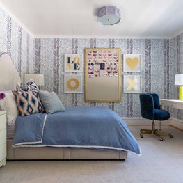 Teen Bedroom with Blue Wallpaper and Gold Accents 