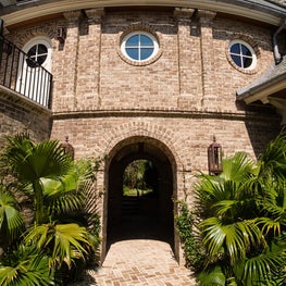 Curved Brick Connector with Arched Breezeway, Pilasters and Round Windows