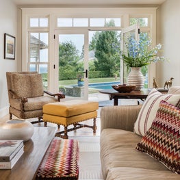 Colorful ottomans stow under coffee table; mustard leather ottoman leopard chair