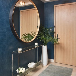 Tribeca foyer complete with Elitis wallpaper and oversized mirror 