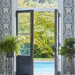 A Conservatory Style Pool Entry with Hand Blocked Wallpaper