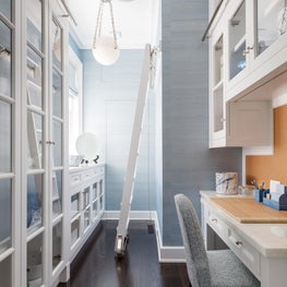 A scullery and home office, complete with a rolling library ladder
