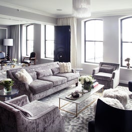 Contemporary grey city apartment living room with large windows
