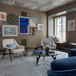 NYC Library with window seat, wallpaper on ceiling, and vintage pieces 