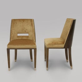 CUSTOM FURNITURE Custom Designed Dining Chairs with Polished Nickel Sabots and trim.