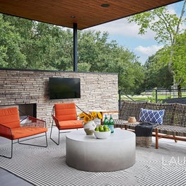 Entertaining is made easy with a bar that connects to the pool house kitchen.