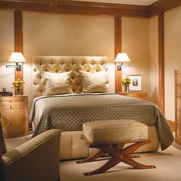 This chic master suite is connected by pocket-doors to a sitting room. 