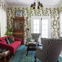 Schumacher monkey wallpaper installed throughout main living area 