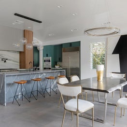Dining Room and Kitchen Shot featuring Custom Stone, Oversized Contemporary Art, and Live-Edge Dining Table