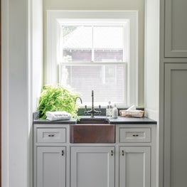 Well Lit Sink Area with Copper Farm Sink