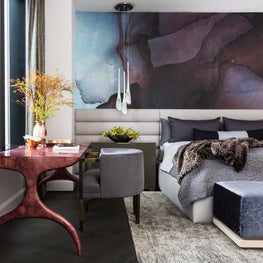 Portfolio: Luxurious bedroom in Houston high-rise with deep hues and soft layers 