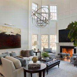 Grand Double-Height Living Room with Fireplace and Large Art