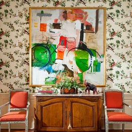 Vibrant seating area featuring a favored art piece. 