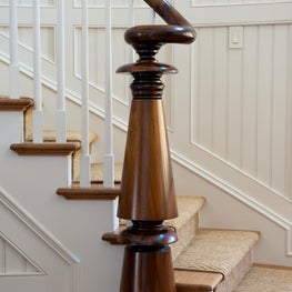 Turned Walnut Newel Post on Bead Board Paneled Stair
