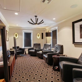 Theatre with layered lighting and custom broadloom carpeting 