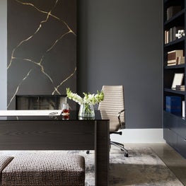 Portfolio: Moody home office with dark grey walls and a custom width desk