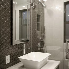 Modern Glam Apartment Renovation - Custom Vanity and Ceramic Wall Tile 