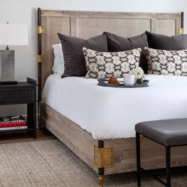 Portfolio: Modern guest bedroom with a havana wood finish and dark wenge nightstand