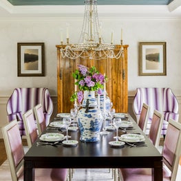Colorful purple and lavender dining room with black lacquer table blue and white