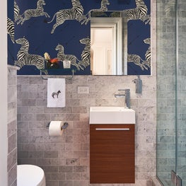 Zebra wallpaper in modern powder room