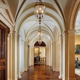 Plaster groin vaults and a burl walnut parquetry floor in a classical gallery