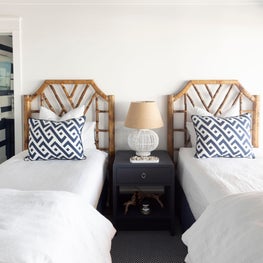 Twin beds in a bay house bedroom