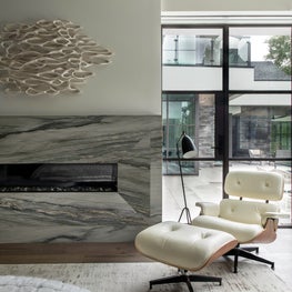 Portfolio: Mid-Century Modern Bedroom with Neutral Hues and an Eames Lounge Chair