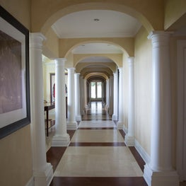 Hallway with white pillars on each side